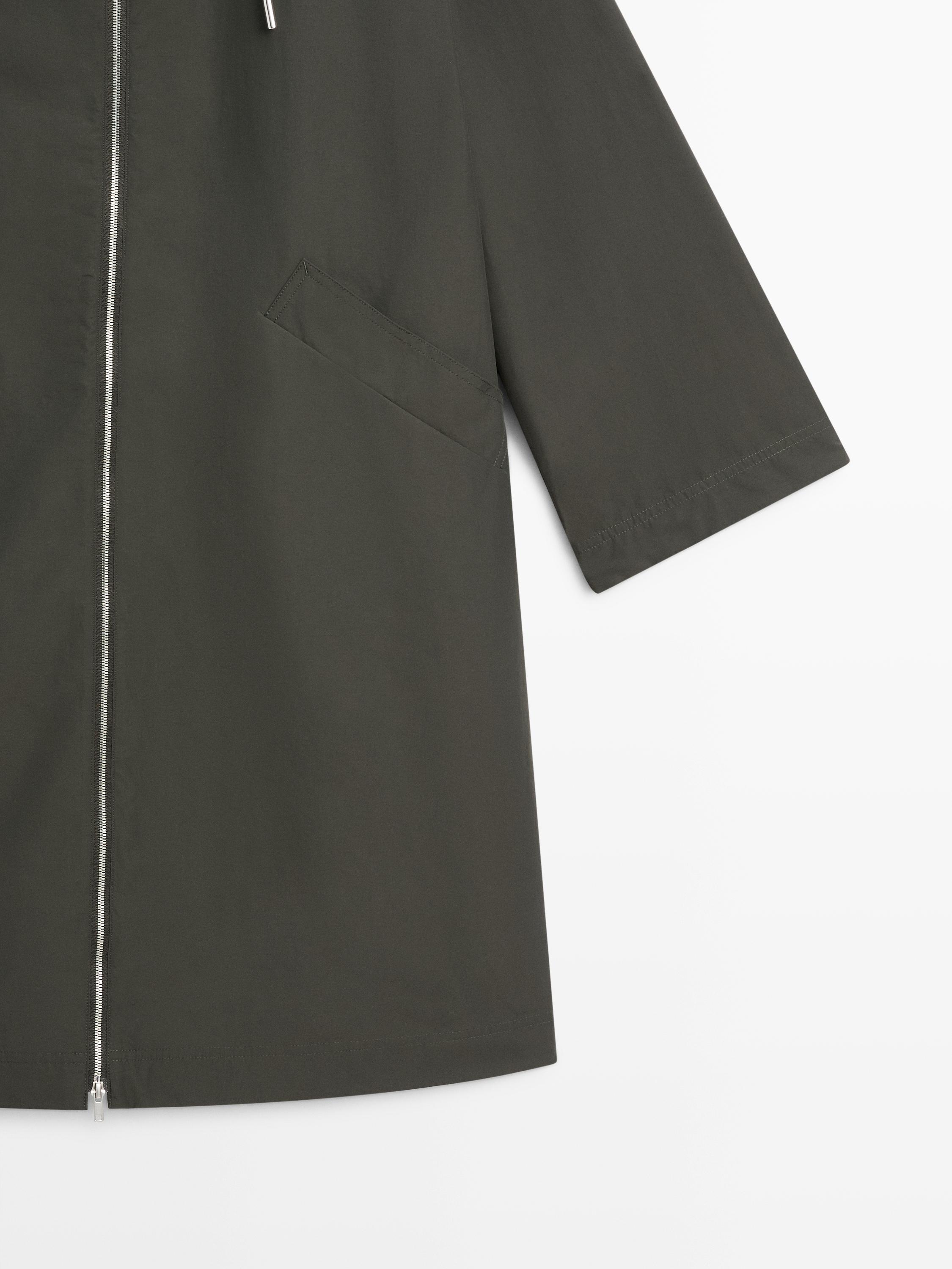 Trench tissu technique à capuche